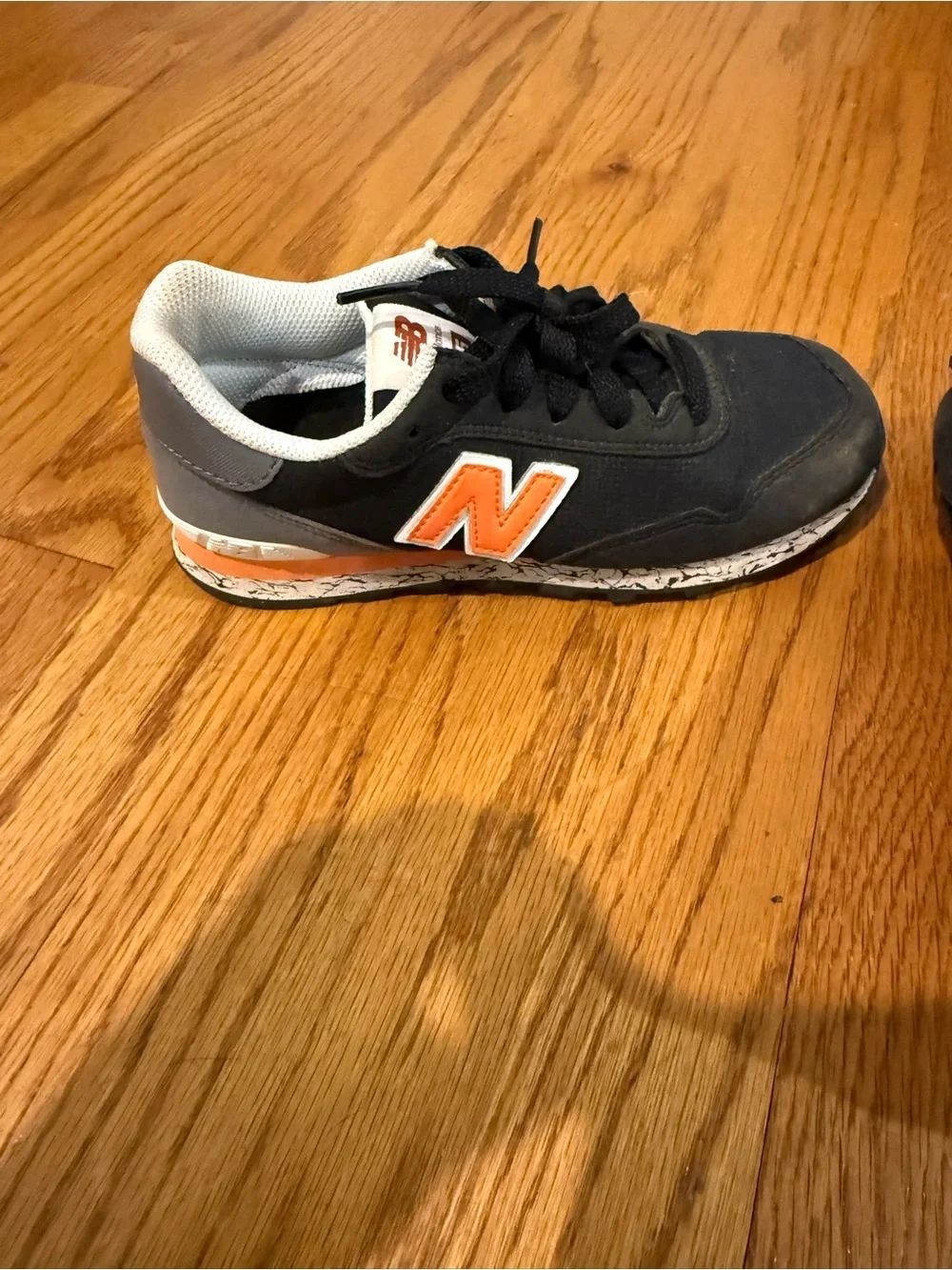 New Balance Kids Black and Orange Low-Top Sneakers